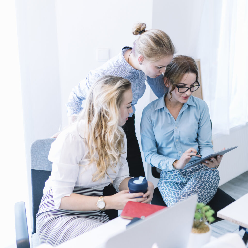 group businesspeople looking digital tablet office meeting