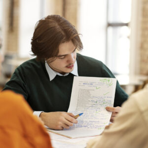 man studying grammar with his colleagues
